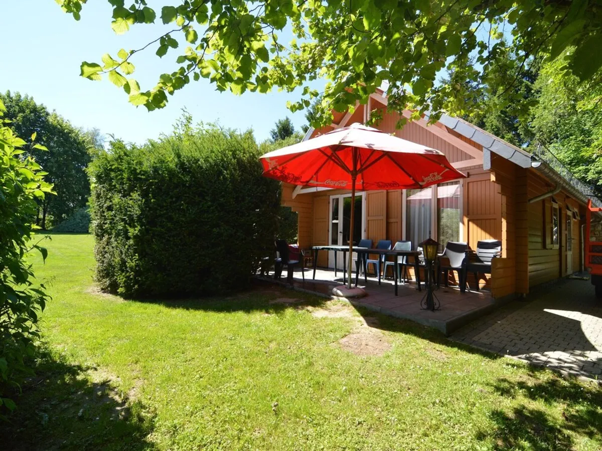 Image of A wooden chalet located in a quiet and green