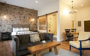 Image of Unique Rustic Suite with Jacuzzi Tub, Kitchen, Fireplace, and Living Room