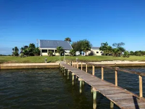 Image of Waterfront Getaway! Relax in this waterfront home with pier on huge lot!