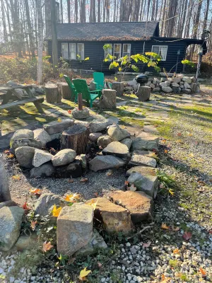 Image of Little Black Cabin in the woods