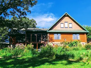 Image of Happy Days Log Home and garden on Fountain Lake. Toys for all!