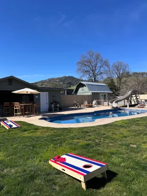 Image of Pool + Waterslide, Spa, & Sauna