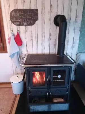 Image of Rural garden house with fireplace and natural panorama