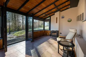 Image of House in the forest with fenced garden