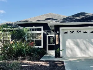 Image of Cheerful 4 Bed, 3 Bath Home with Screened Pool