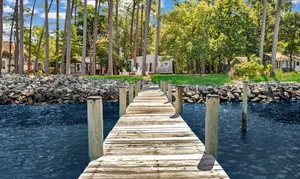 Image of Charming Waterfront Cottage with Sunset Views