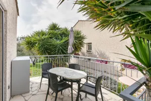 Image of house in swimming pool and tennis court