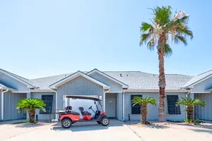 Image of In-town coastal getaway, with a heated pool & level 2 Tesla EV charger on site.