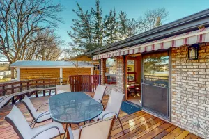 Image of Lake-view home with gas fireplaces, inviting deck & dog-friendly yard