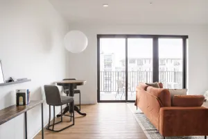 Image of Chic East Side 1BR Apt with Balcony, Pool, and Gym