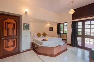 Image of StayVista's Shantam House - Dive into relaxation with a pool and tennis lawn