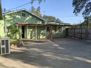 Image of A lake, a mountain and the house with the red door