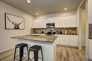 Image of Hygee House Brand New Construction near Ford Idaho Center and I 84 Plush and lavish furniture warm tones to off set the new stainless appliances play PingPong in the garage or basketball at the neighborhood park