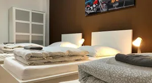 Image of cosy three room apartment with flatscreen TV