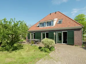 Image of Spacious farmhouse in wooded area