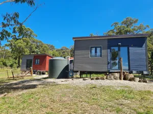Image of Unique two tiny homes set up with private dam