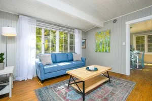 Image of Adorable Cottage Among Trees Close To Everything