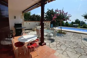 Image of 5-bedroom house with pool at edge of small village