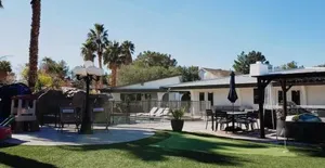 Image of Luxury Villa, with bonus pool house, Private Pool, Hot tub, rock water fall and slide, putting green, basketball, shuffle board, play gym, privately gated on circular driveway.