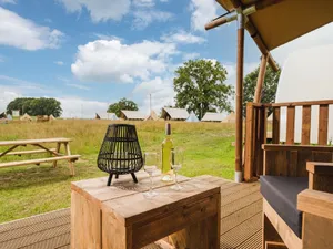 Image of Tent with shower and kitchen, on a pop-up campsite