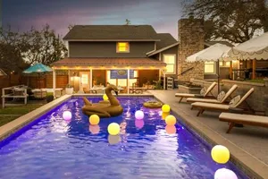 Image of Lux 5BR gem with Heated Pool, SPA, and Outdoor Movie Theater
