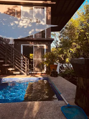 Image of A Romantic Poolside Room near the beach.