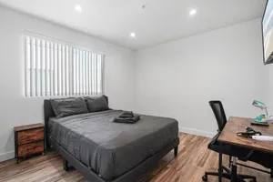 Image of Spacious Bedroom With Shared Bathroom