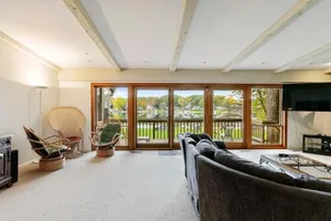 Image of The Lake House on Powers - Grassy Frontage - Lakeside Deck - Rec Room with Pool Table - Fire Pit