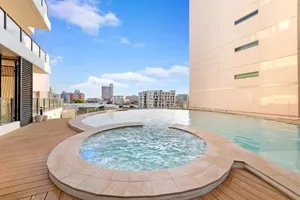 Image of High-Rise Modern Oasis with Pool and City Views