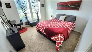 Image of Comfortable Queen Bedroom with workspace