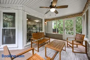 Image of Relax In This 4BR Retreat With Screened Snug Porch