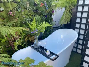Image of Mini Love Island style guest house includes personal hot 24 hour swimming pool, outdoor bathtub, heated dining dome and fire pit, all this is secretly located in the busy suburbs of Nottingham
