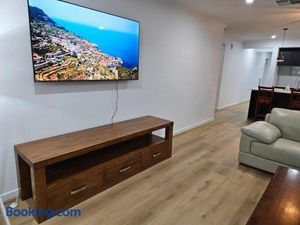 Image of O Stylish 4 Room Oasis with 65 TV