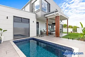 Image of 4 Bedroom Home in Pelican Waters with Heated Inground Pool