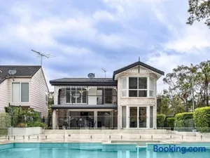 Image of Riverfront Oasis Spacious 5BR Luxury w 10m Pool