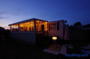 Image of Mobil Home 3 chambres 2 salle de bain 2 WC Camping 4 Stars LES CHARMETTES Parcelle privée prestige