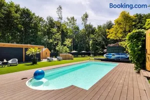 Image of Green Tiny House with shared pool