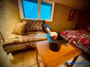 Image of Résidence CAENEE, le dépaysement Naturiste en été avec l'atypique studio climatisé "vintage" en sous pente, sa "paillote" avec jacuzzi, entouré de verdure, planchagrill, transats, vélos gratuits, wifi 5G, Travel Proud LGBTQI, chiens admis