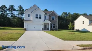 Image of Charming Serenity Awaits The Zebra & Coffee Suites - Dual Queen Bedrooms with Exclusive Comforts, Open Quartz Kitchen, and Lush Patio Near Shopping Bliss