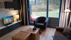 Image of 't STRANDHUYS en DE VUURTOREN, met eigen KEUKEN, ZONNIG TERRAS nabij DORP, DUINEN en STRAND, Incl verwarmd binnen ZWEMBAD