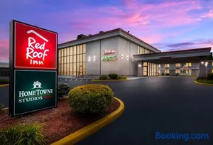 Image of HomeTowne Studios by Red Roof Painted Post