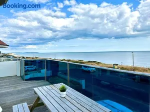 Image of Stunning Panoramic Sea View Beach Location - Sleeps up to 4 People - Free Parking - The Best Beach! - Great Location - Fast WiFi - Smart TV - Newly decorated - sleeps up to 4! Close to Bournemouth & Poole Town Centre & Sandbanks
