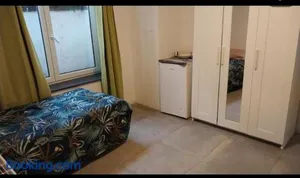 Image of Chambre deux lits célibataires sous -sol cle ancien