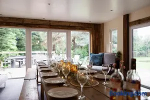Image of Cheerful 7-bedroom house with hot tub sleeps 25