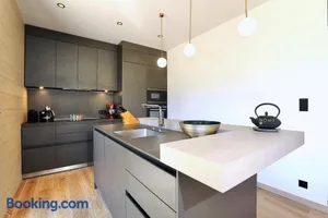 Image of New modern chalet with skis on