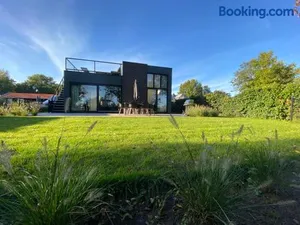 Image of GREEN VILLA in bester Lage - Dachterrasse mit Meerblick - großer eingezäunter Garten - kinderfreundlich - Hunde inklusive - 4 Sterne Resort - direkt am Strand - Pool inklusive
