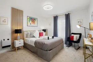 Image of Beach Block 2-Bed with Coastal Palm Trees and Yard