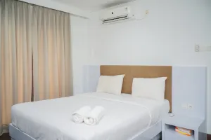 Image of Homey and Modern Tamansari Semanggi 2BR Apartment By Travelio