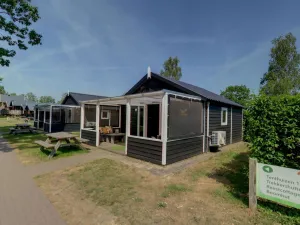 Image of Tent lodge with covered terrace, in green area