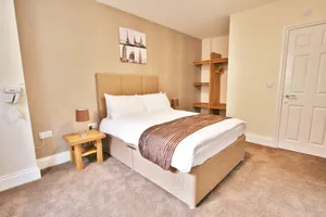 Image of New County Hotel & Serviced Apartments by RoomsBooked